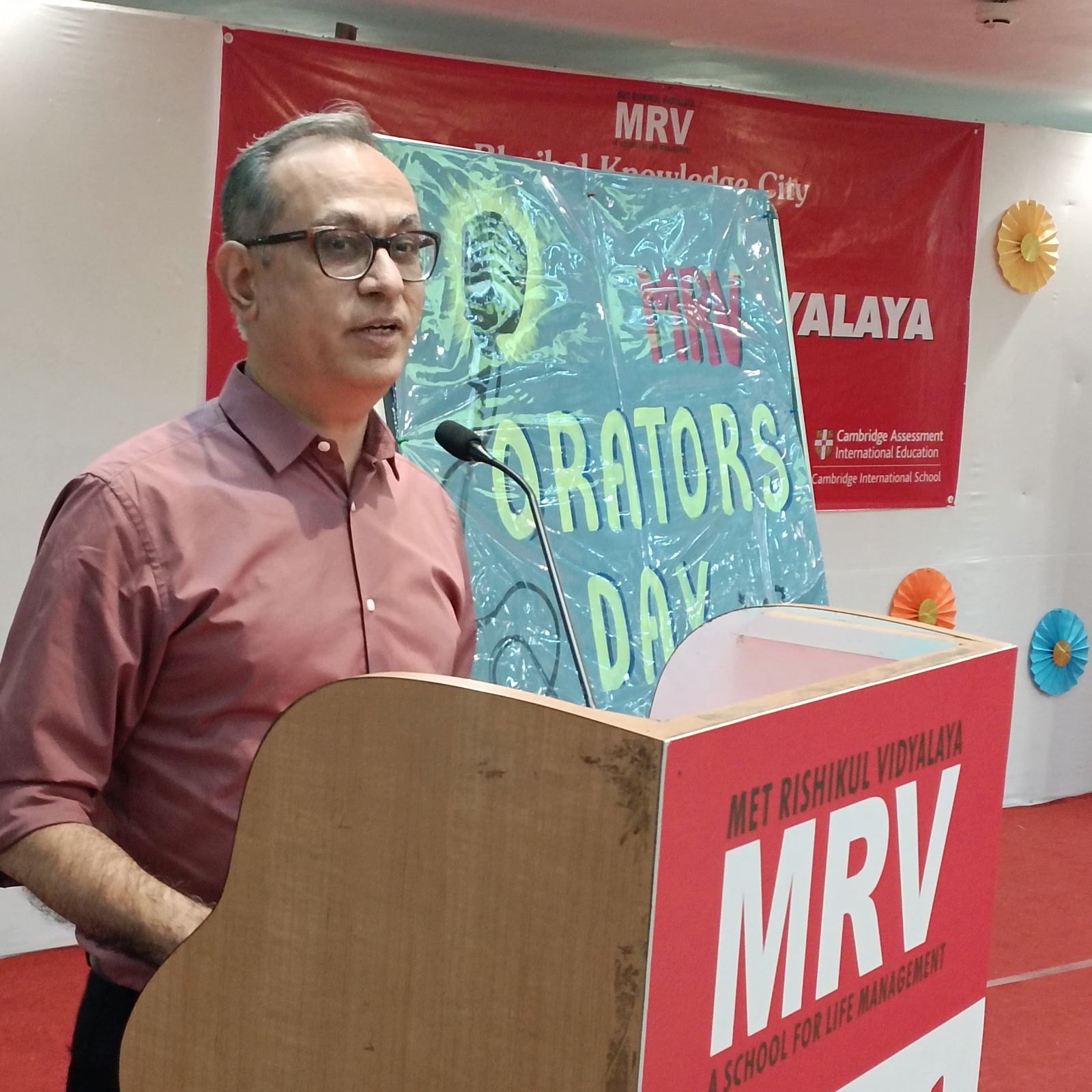 Malay Damania speaking on stage